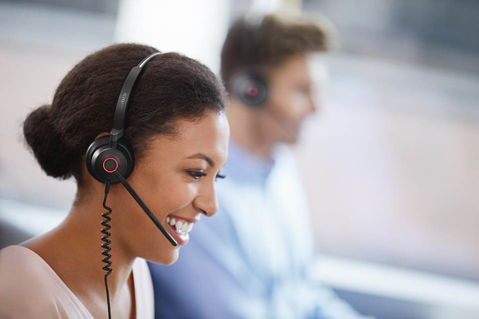 Customer service lady helping customer on phone via voip