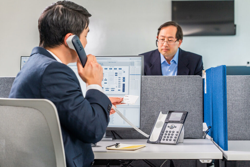 Business men making phone call in office