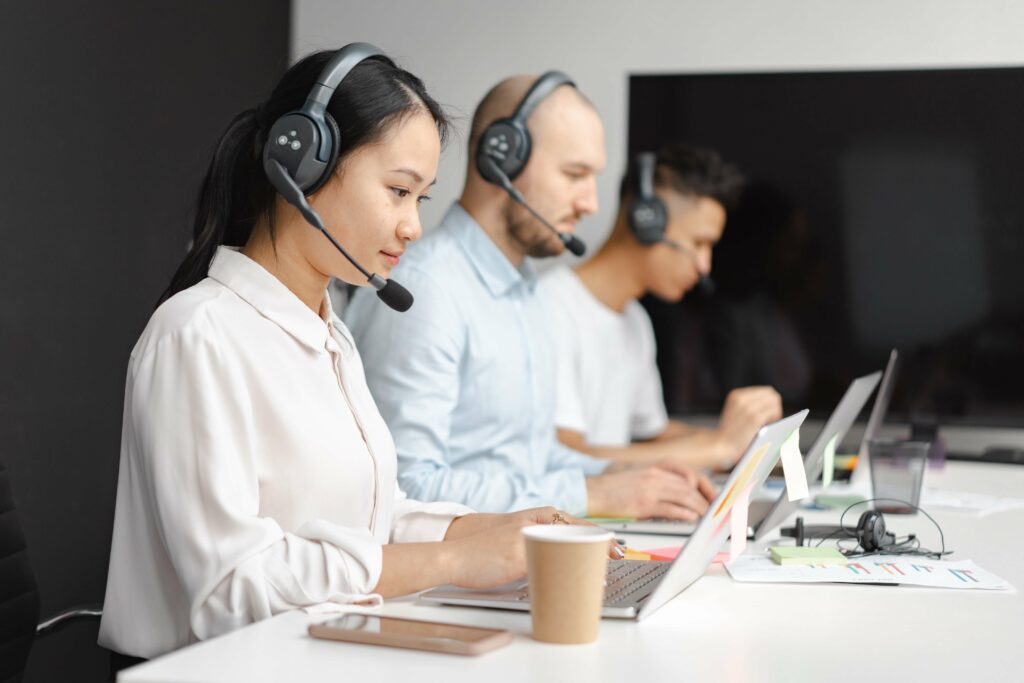 call centre team on headsets using voip phone systems
